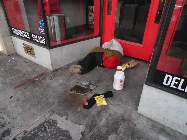 Homeless person in Berkeley CA with food from The Little Way Homeless Outreach